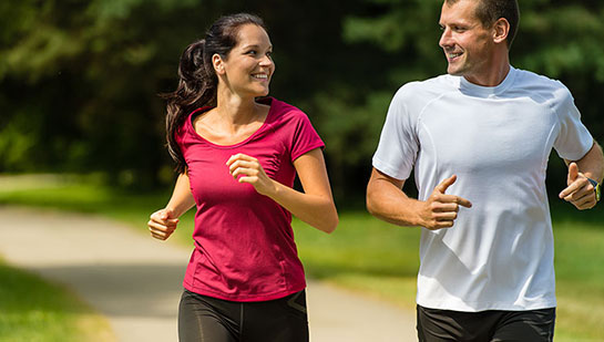 Husband and Wife out on a jog follow health advice from Goodyear chiropractor